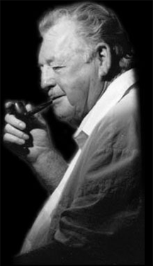 A man smoking a pipe while wearing a white shirt.